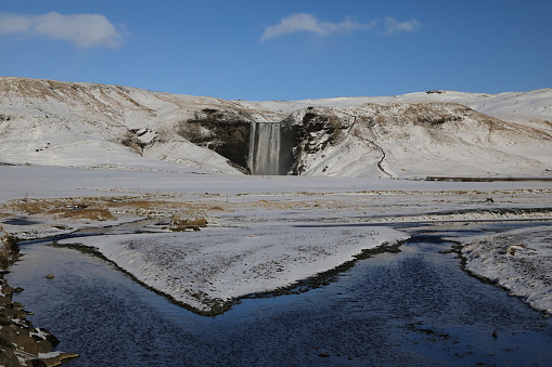 Iceland, Skogar, Skogafoss, Skogafoss waterfall surrounded by snow and ice in winter