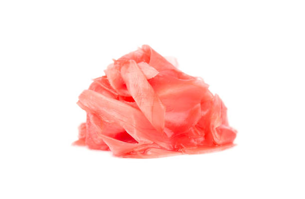 istock Pile of marinated ginger slices isolated on white background. 870714404