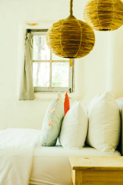 istock Pillow on bed decoration in bedroom interior 870714780