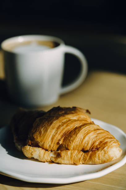 istock Continental breakfast with coffee and croissant 870718374