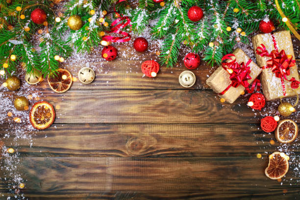 istock Christmas winter background, a table decorated with fir branches and decorations. Happy New Year. Merry Christmas 870722976