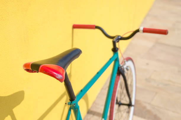 istock A City bicycle fixed gear on yellow wall 870723298