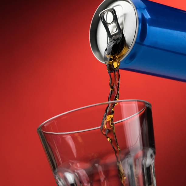 istock Pouring a soft drink in a glass 870723574