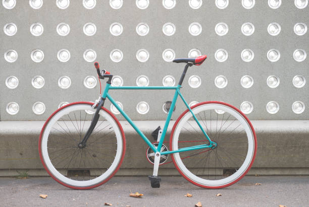 istock A City bicycle fixed gear on a green and white wall 870723620