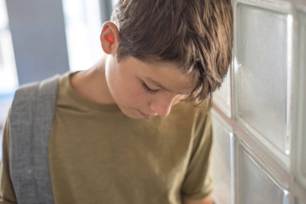 istock Student resting on the school and playing with a mobile phone 870723788