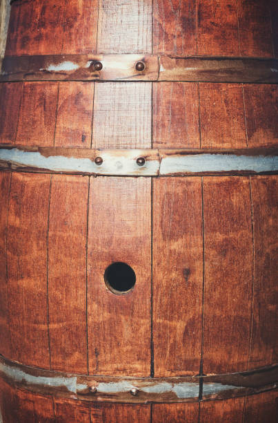 istock Traditional wooden wine barrel closeup 870729878