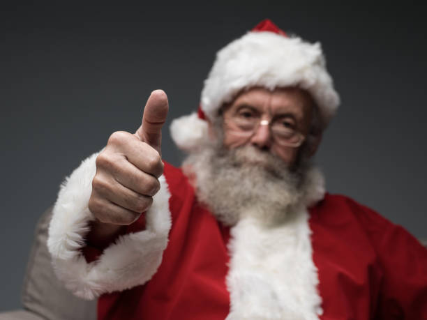 istock Cheerful Santa giving a thumbs up 870732646