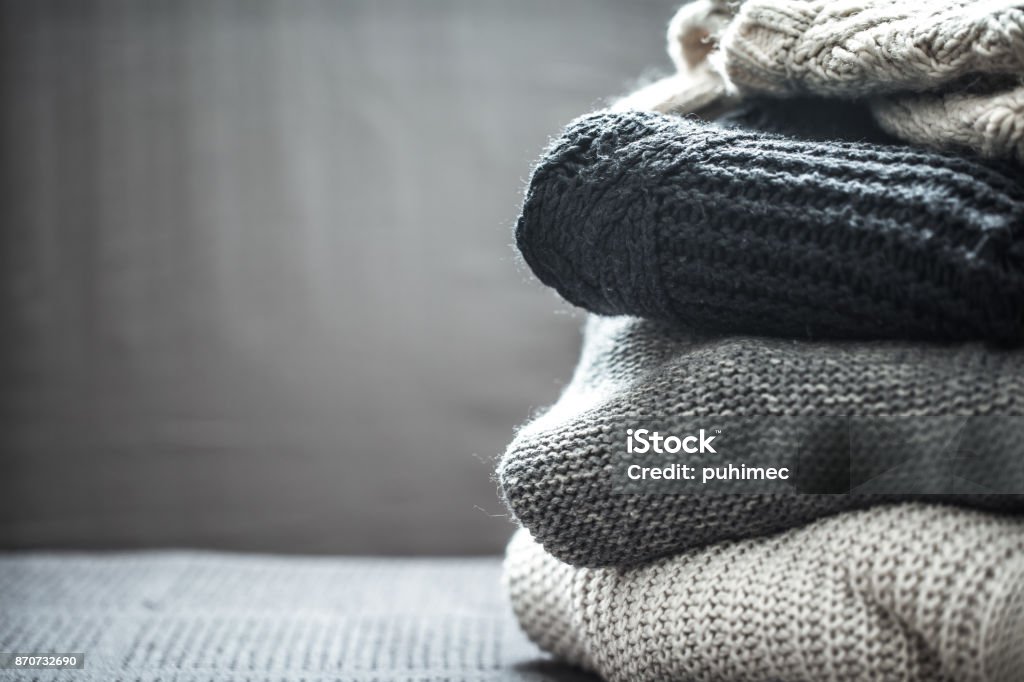 A stack of knitted sweaters A stack of knitted sweaters ,the concept of warmth and comfort, hobby , background,closeup Clothing Stock Photo