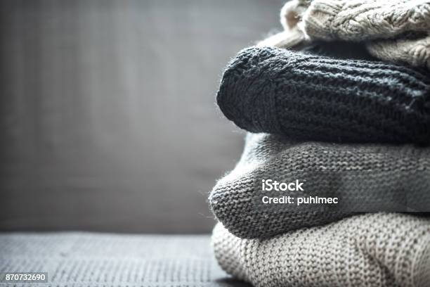 A Stack Of Knitted Sweaters Stock Photo - Download Image Now - Clothing, Archival, Arts Culture and Entertainment