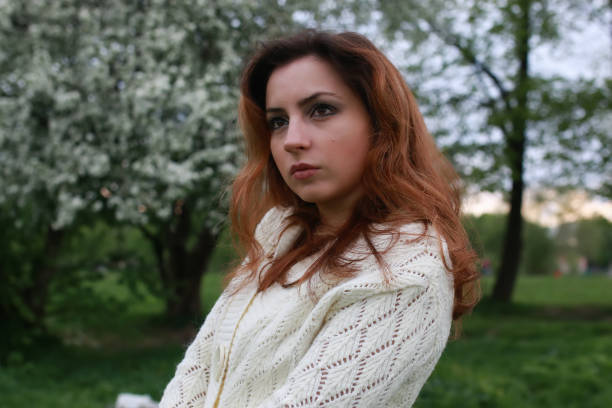 istock girl portrait spring tree 870735460
