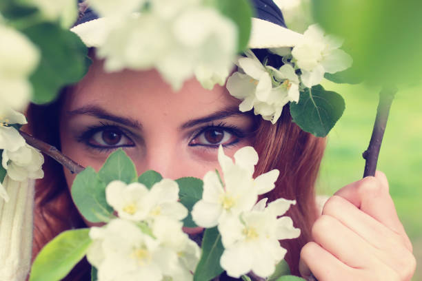 istock girl eye in branch tree flower 870735570