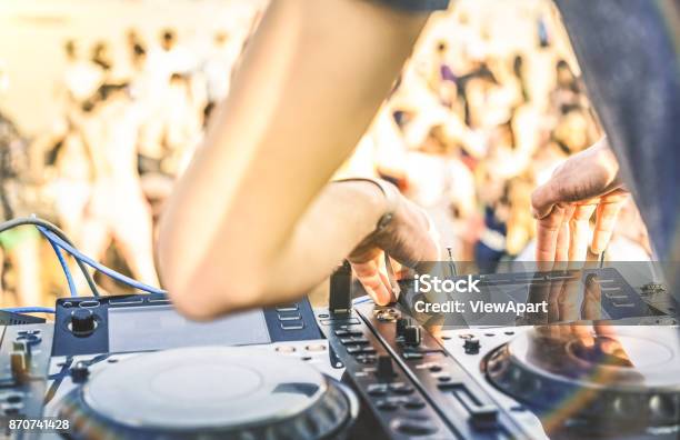 Close Up Of Dj Playing Electro Sound On Modern Cd Usb Player At Summer Beach Party Music Festival And Entertainment Concept Defocused Background With Shallow Depth Of Field Focus On Mixing Hand Stock Photo - Download Image Now