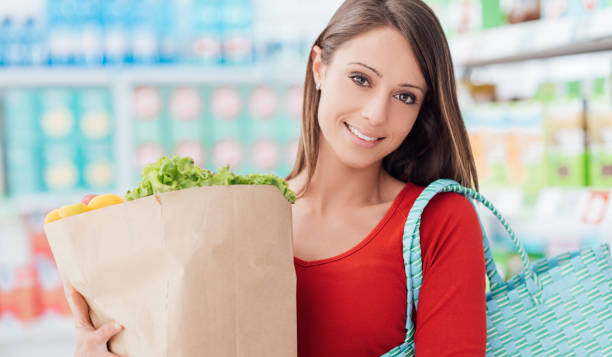 istock Woman buying fresh vegetables 870755346