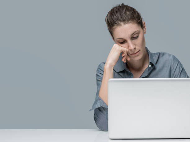 istock Tired woman sleeping in the office 870755640