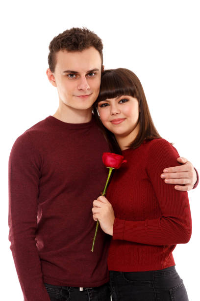 istock Teenage couple on white 870764836