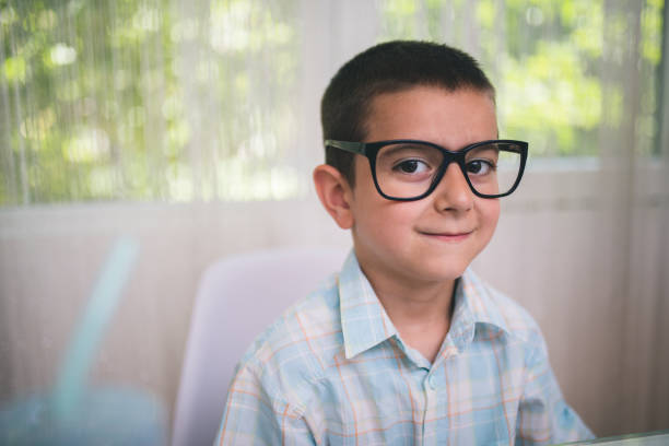 istock Funny adorable little kid boy with glasses 870780828