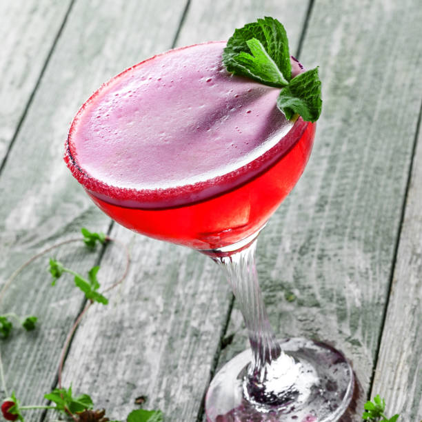 istock Glass of alcoholic raspberry and mint cocktail 870781234
