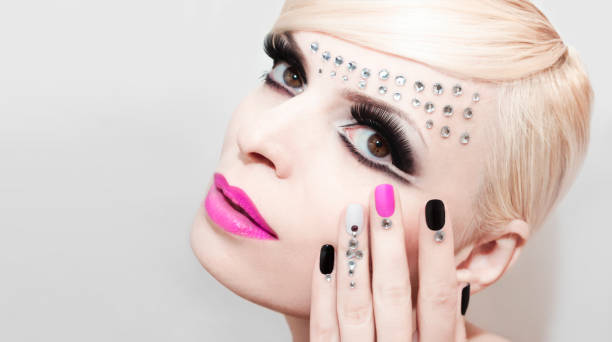 istock Manicure and makeup with pink color. 870784494