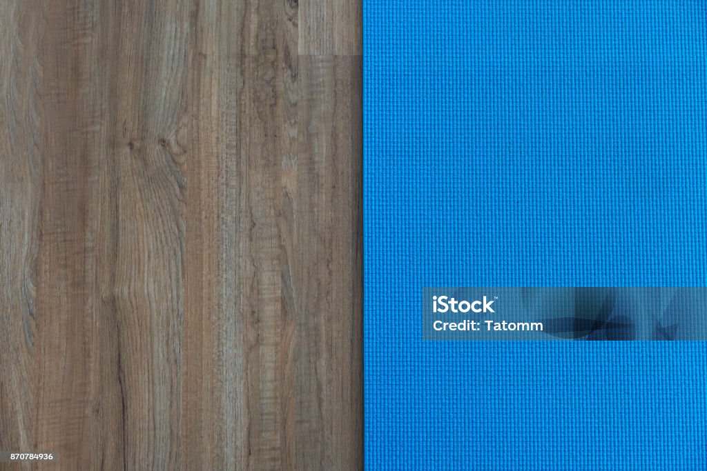 yoga mat on table, fitness healthy and sport concept Exercise Mat Stock Photo