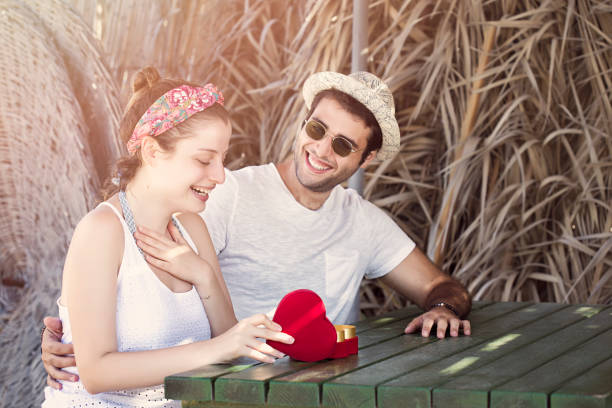 istock Young couple on a valentine's day on the beach 870796312