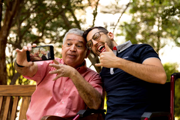 istock Dad and son taking selfie and having fun in the park 870798490