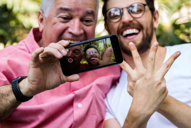 istock Dad and son taking selfie and having fun in the park 870798492