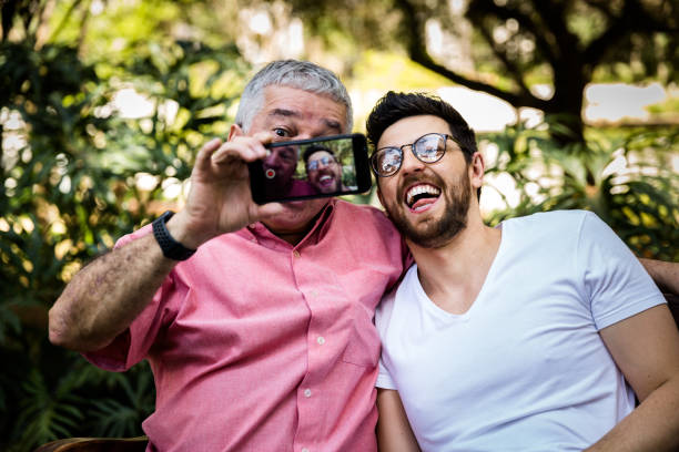 istock Dad and son taking selfie and having fun in the park 870798494