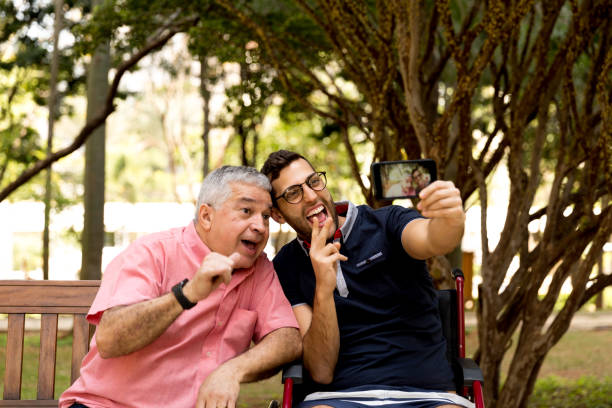 istock Dad and son taking selfie and having fun in the park 870798500