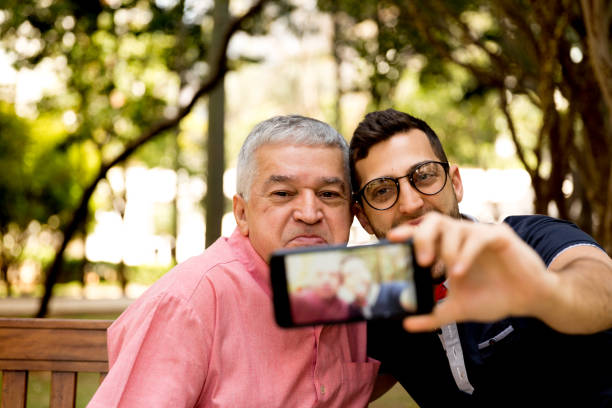 istock Dad and son taking selfie and having fun in the park 870798506