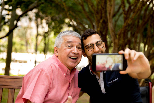 istock Dad and son taking selfie and having fun in the park 870798508