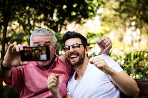 istock Dad and son taking selfie and having fun in the park 870798516