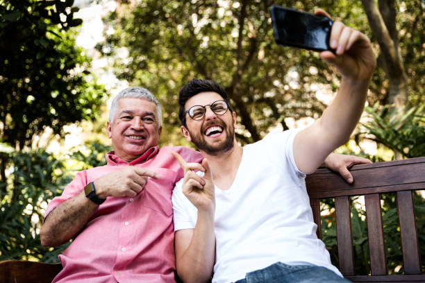 istock Dad and son taking selfie and having fun in the park 870798530