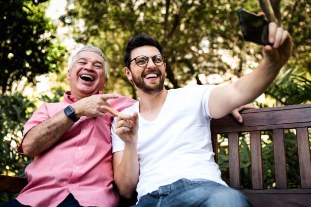 istock Dad and son taking selfie and having fun in the park 870798534