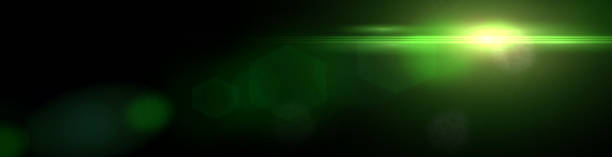 istock intense green lens flare effect overlay texture banner with hexagonal bokeh effect in front of a black background 870798756