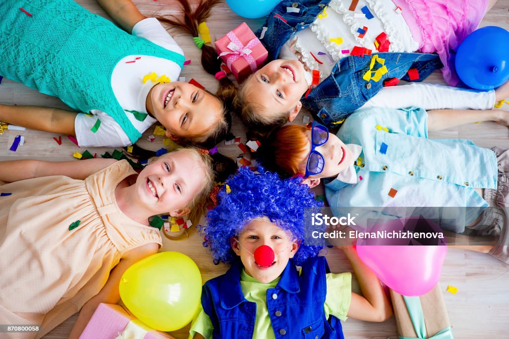 Teens birthday party Group of teens on a birthday party with clowns Child Stock Photo