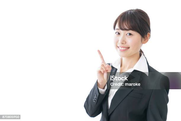 Business Woman Pointing To Something Stock Photo - Download Image Now - Japanese Ethnicity, Suit, Females