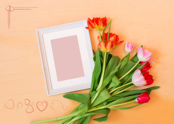 istock Picture frame and tulip flowers 870810888