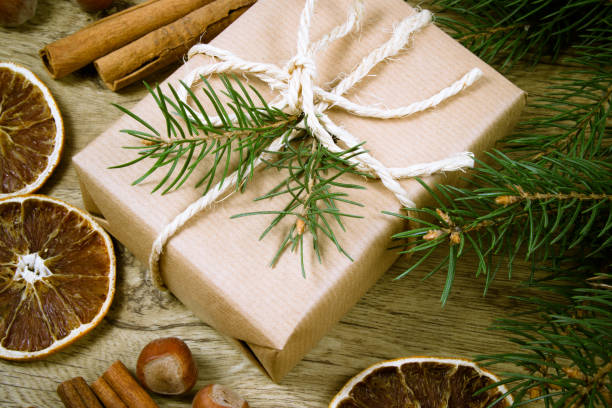 istock Christmas gifts in rustic boxes on wooden background. 870810894