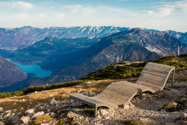 istock lonely bench in the alps mountain 870811206