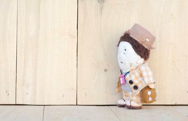 Doll's men on a wooden floor .