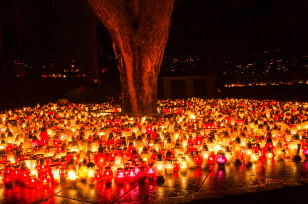istock Graveyard candles on Polish cemetery during All Saints Day at night. 870821642