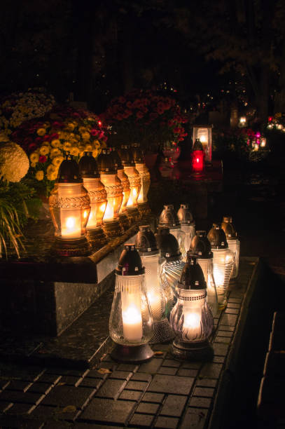 istock Graveyard candles on Polish cemetery during All Saints Day at night. 870821904