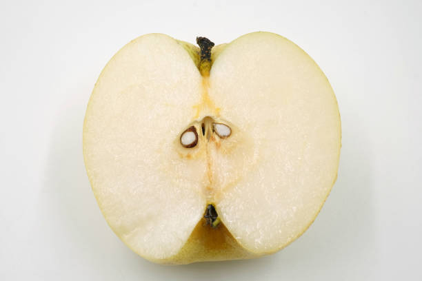 istock half of chinese pear on white background 870825010