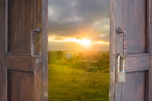 istock abstract old wood window open to landscape sun light filter and len fare effect - can use to display or montage on product 870828422