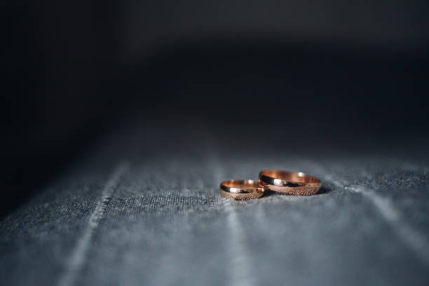 istock Top view at wedding rings placed on bed 870828808