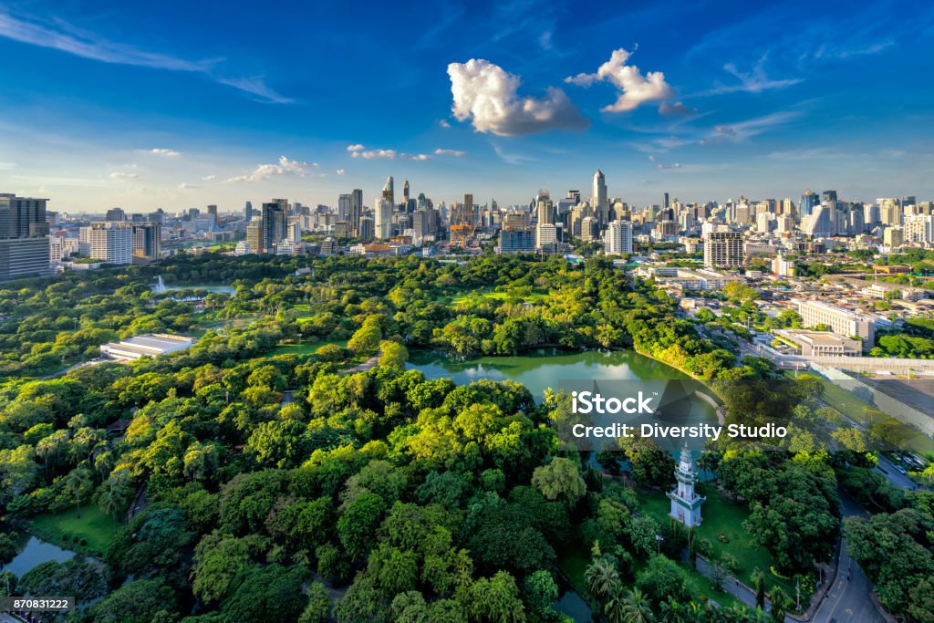 Sunset scence of Bangkok skyline Panorama Sunset scence of Bangkok skyline Panorama ,Aerial view of Bangkok modern office buildings and condominium in Bangkok city downtown with sunset sky and clouds at Bangkok , Thailand. Lumpini park Bangkok Stock Photo