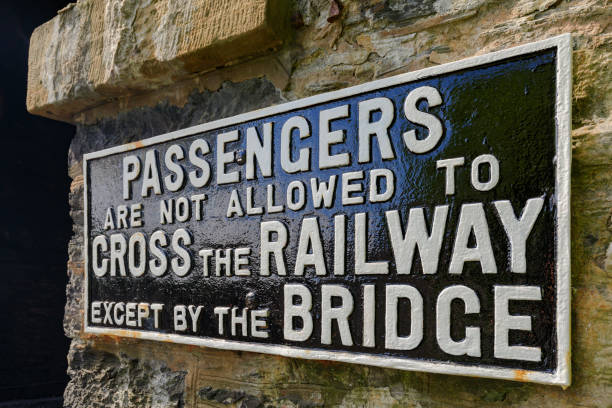 warning sign at a British railway station