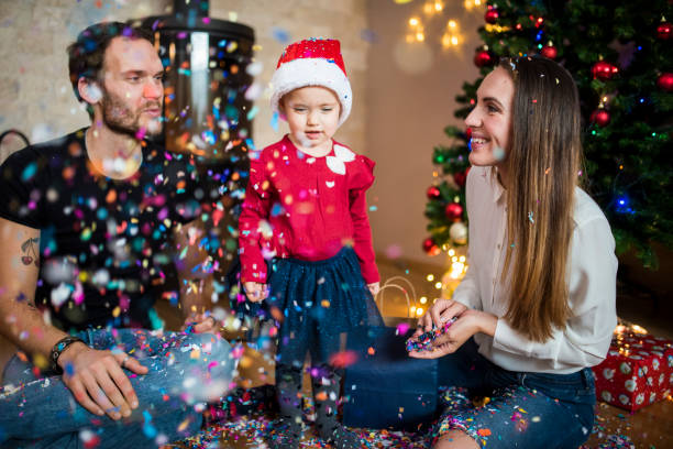 istock Family throwing confetti at Christmas 870844306