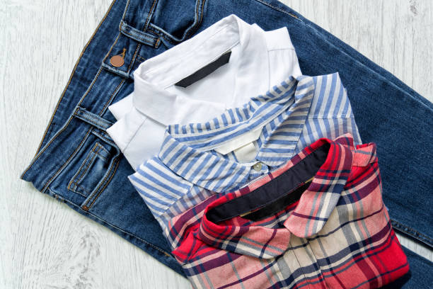 istock Three shirts on jeans, white, checkered, striped. Collage. Fashionable concept. 870846678