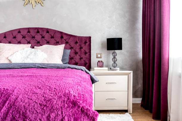 istock Matrimonial double bed in elegant and comfortable modern bedroom. Interior design details 870849960